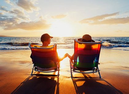 Couple watching sunset on a secluded beach in a Costa Rica romantic getaway